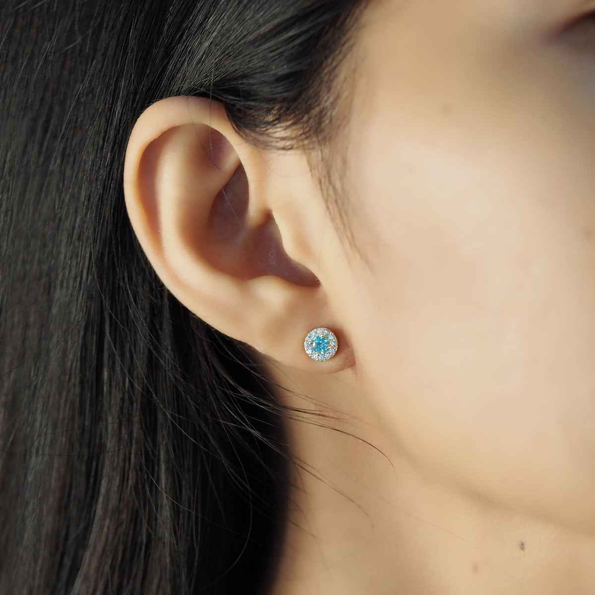 Stud With Blue Center Stone And Pave Halo