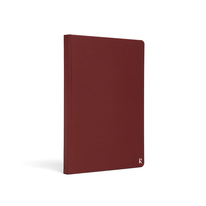 Karst A5 Stone Paper Notebook with burgundy red hard cover, eco-friendly waterproof notebook for journaling, planning, note-taking, and everyday productivity.