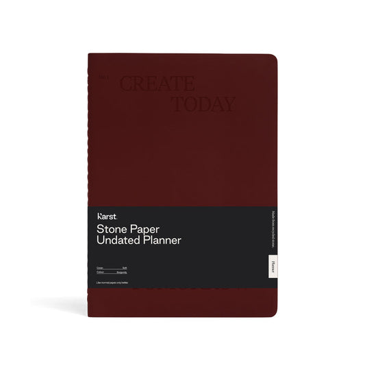 Front view of a burgundy Karst Stone Paper Undated Planner notebook with the phrase “Create Today” embossed on the cover and a black product band labeled “Stone Paper Undated Planner,” displayed against a white background.
