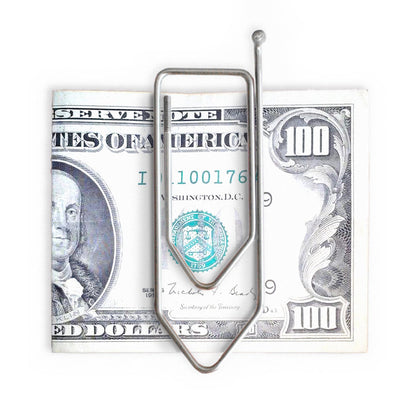 Stainless steel wire money clip puzzle holding a US 100 dollar bill, minimalist metal brain teaser that doubles as a clever money holder gift.