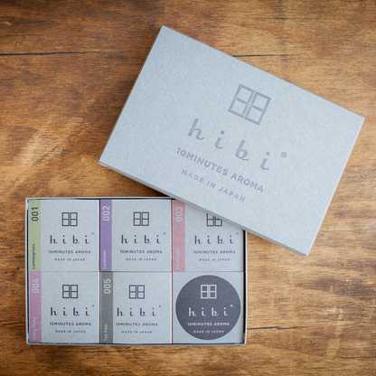 Hibi 10 Minutes Aroma assorted incense matches gift box opened on wooden surface, featuring six Japanese incense scents in minimalist packaging.