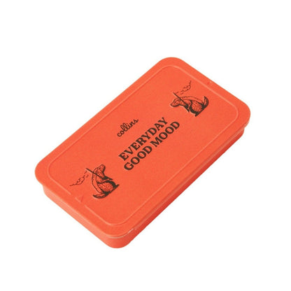 Bright orange Collins Everyday Good Mood incense tin with playful illustrated graphics, compact minimalist storage case for modern home fragrance and incense accessories.